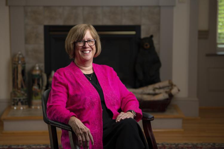 Photo of Joan Ferrini-Mundy sitting in chair